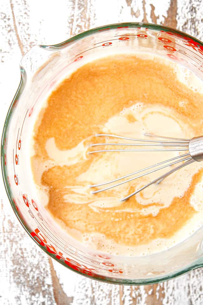 showing how to make tres leches cake by stirring sweetened condensed milk, evaporated milk and heavy cream together