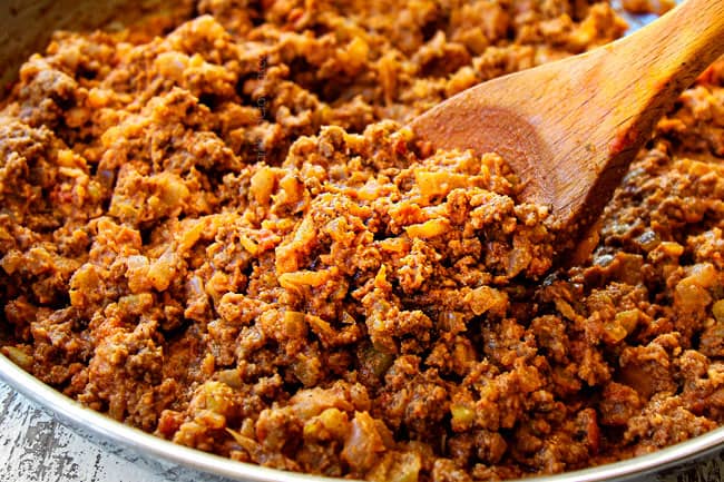 showing how to taco meat by cooking ground beef with seasonings, salsa and green chilies