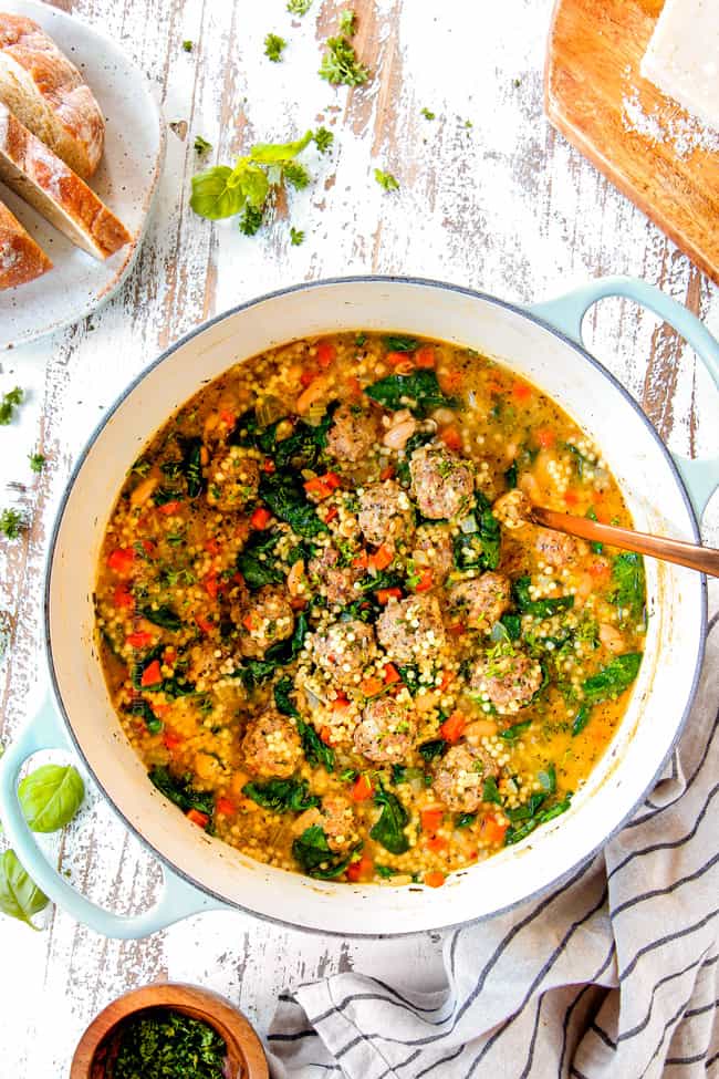 top view of a Dutch oven of Italian Meatball Soup recipe with a ladle ready to serve