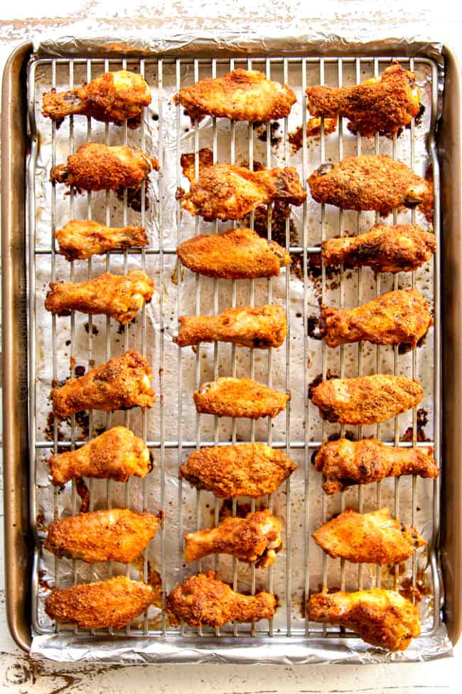 showing how to make lemon pepper chicken wings by baking wings until crispy