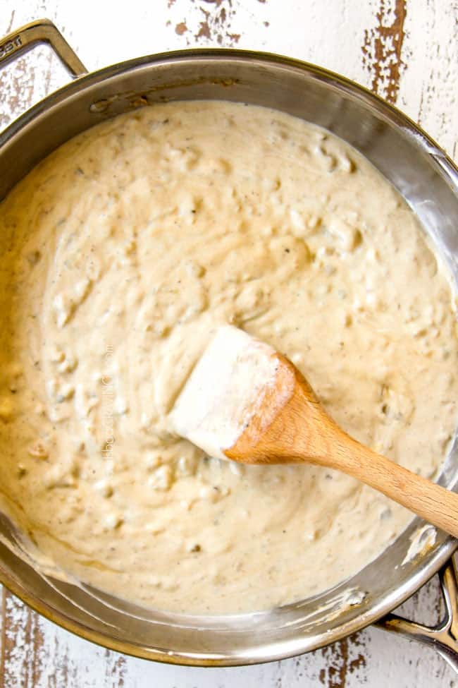 showing how to make easy enchilada casserole by stirring sour cream into enchilada sauce until smooth