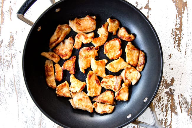 showing how to make Moo Goo Gai Pan by searing thinly sliced chicken on both sides in a skillet