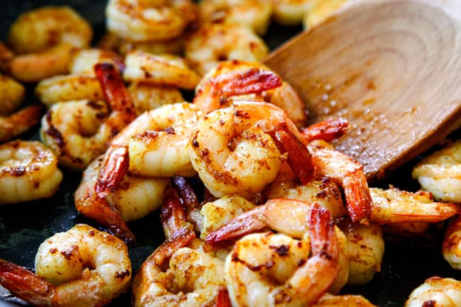 showing how to make Singapore Style Noodles by cooking shrimp until opaque in a nonstick skillet