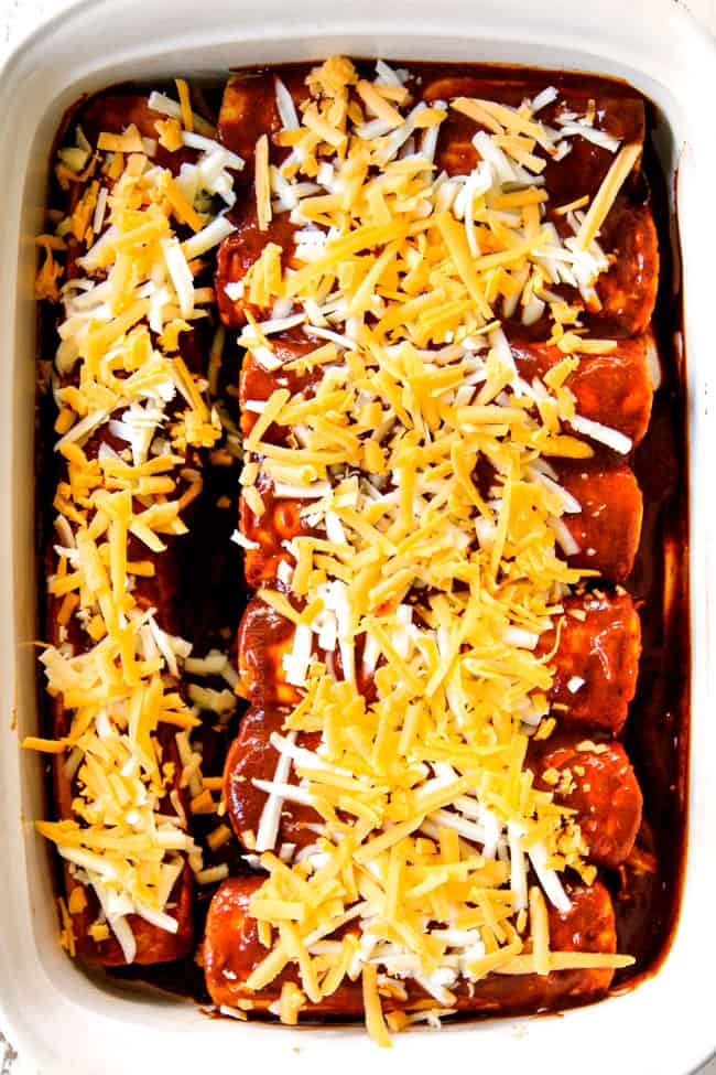 showing how to make chicken enchilada recipe by adding cheese to the top of enchiladas before baking