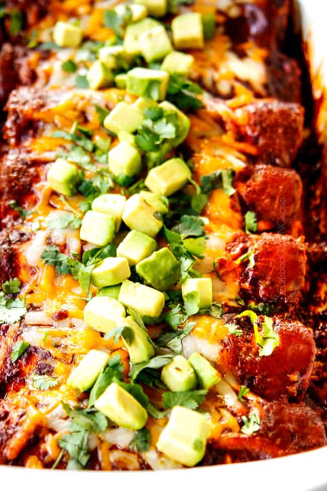 showing how to use enchilada sauce recipe with a pan of chicken enchiladas with enchilada sauce poured over top