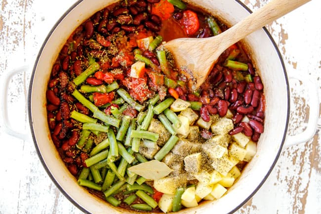 showing how to make Cabbage Soup by adding green beans, potatoes, kidney beans to soup