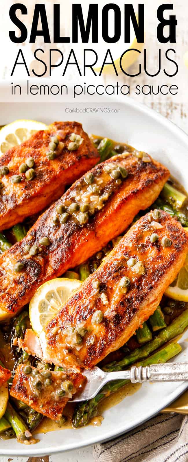 showing how tender lemon salmon  and asparagus is taking a bite with a fork
