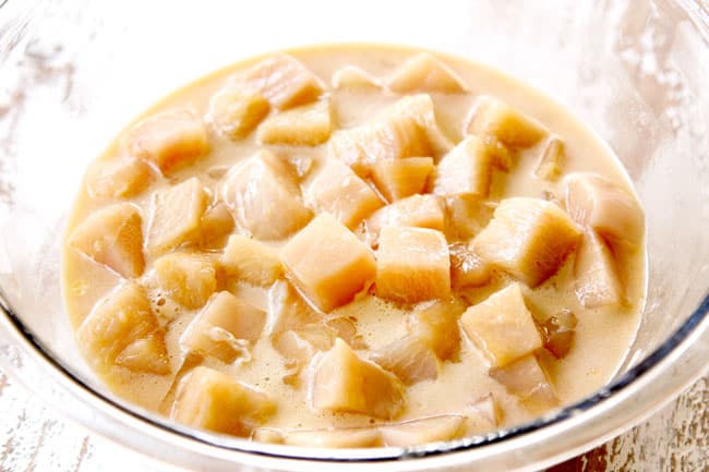 showing how to make sweet and sour chicken by marinate chicken