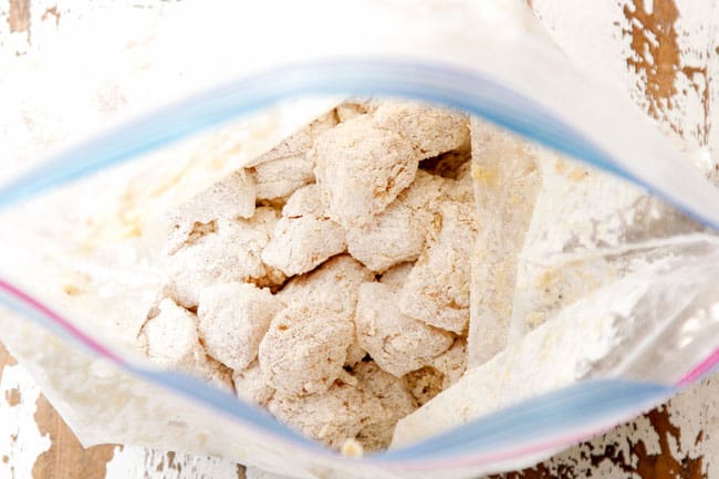 showing how to make sweet and sour chicken by breading chicken in flour and cornstarch