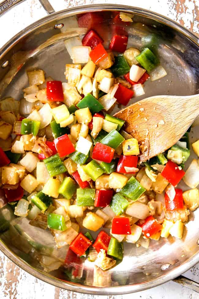 showing how to make sweet and sour chicken by stir frying bell peppers