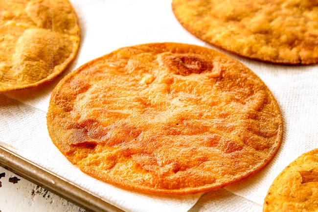 showing how to make tostadas by frying corn tortillas to make tostada shells