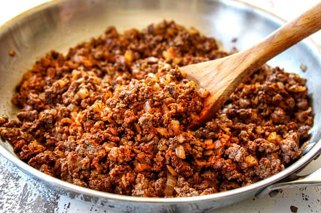 showing how to make tostada recipe by browning beef and onions in a skillet