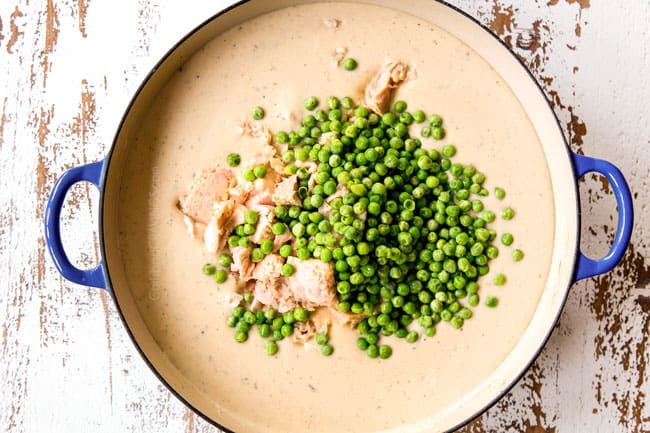 showing how to make Tuna Noodle Casserole by adding tuna and peas to the Mornay sauce