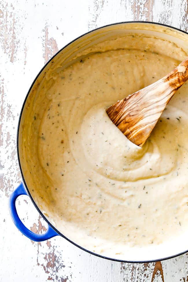 top view of creamy mornay sauce for tuna casserole n a blue saucepan