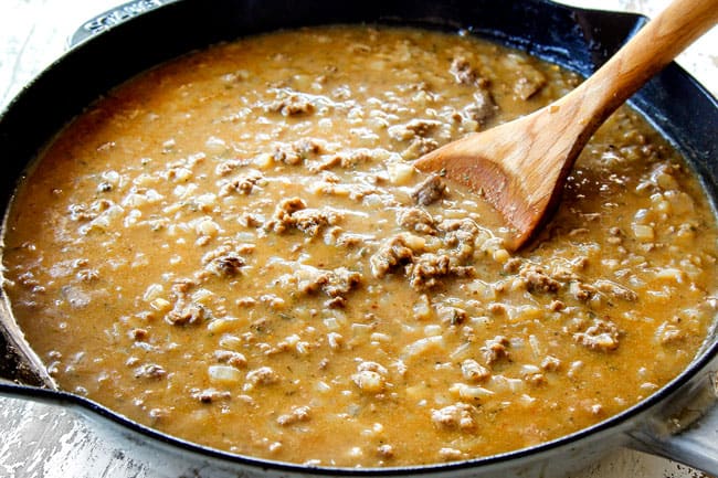 showing how to make best ground beef stroganoff by adding beef broth and seasonings and simmering until thickened