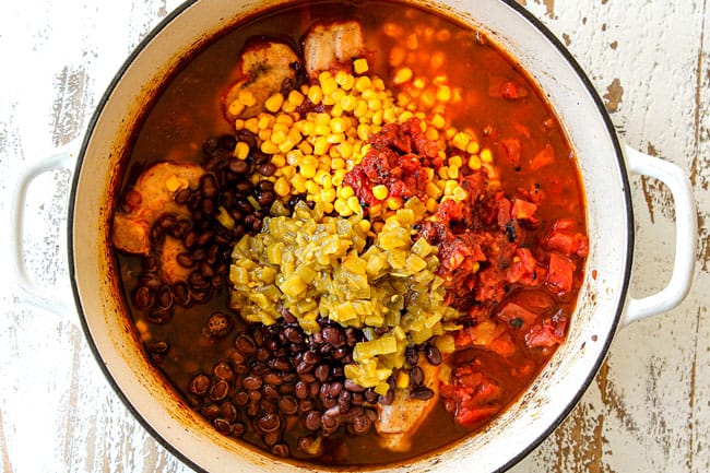 showing how to make creamy Chicken Enchilada Soup by adding tomatoes, black beans, corn and green chilie to soup
