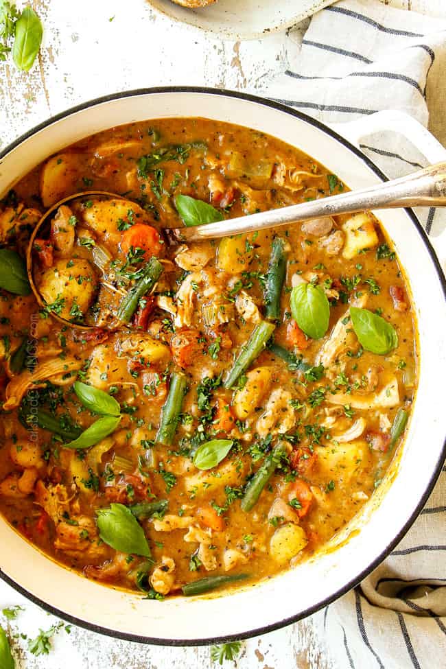 top view of a white pot of chicken stew showing how thick and creamy it is