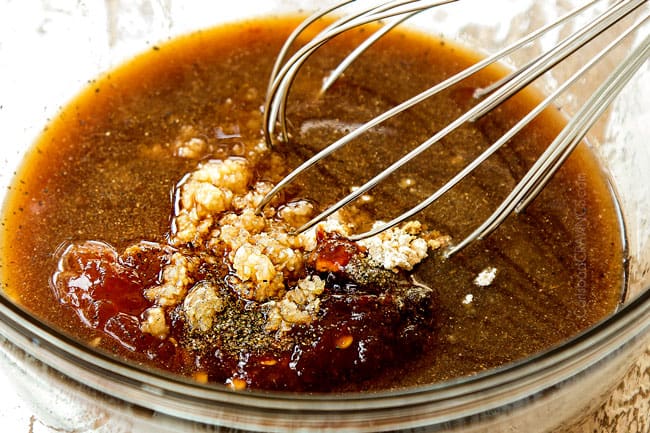 showing how to make Honey Garlic Chicken by whisking soy sauce, water, soy sauce, hoisin, chili sauce, garlic and ginger