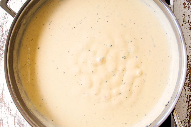 showing how to make mac and cheese by simmering sauce until thickened