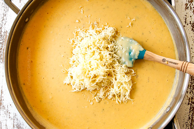 showing how to make mac and cheese by stirring in Gouda cheese