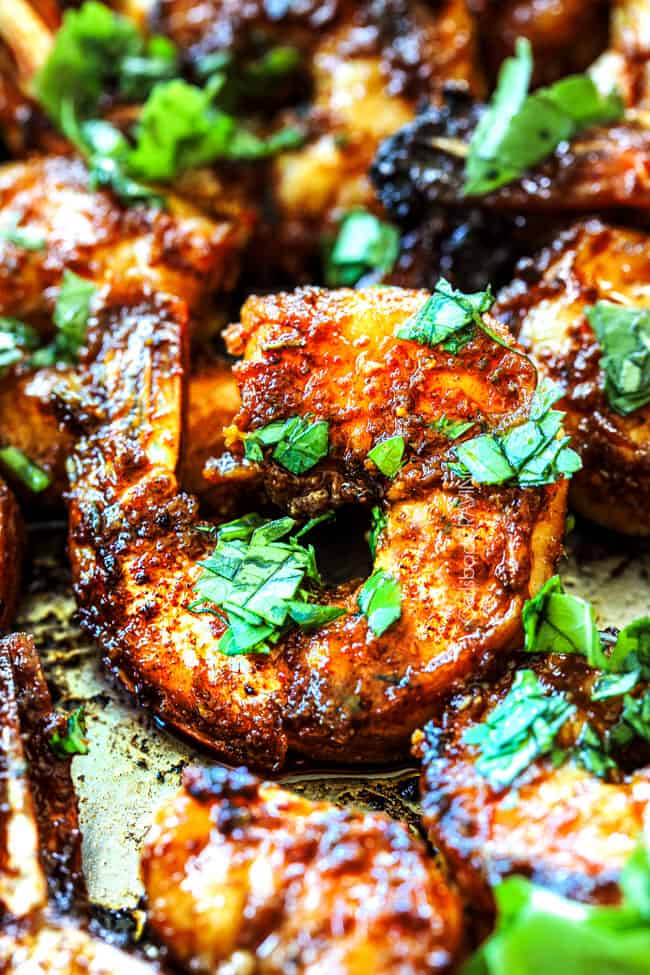 up close of jerk shrimp in a skillet showing juicy it is