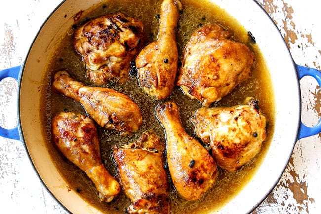 showing how to make Chicken Adobo recipe by adding marinade and water to the pan with the seared chicken