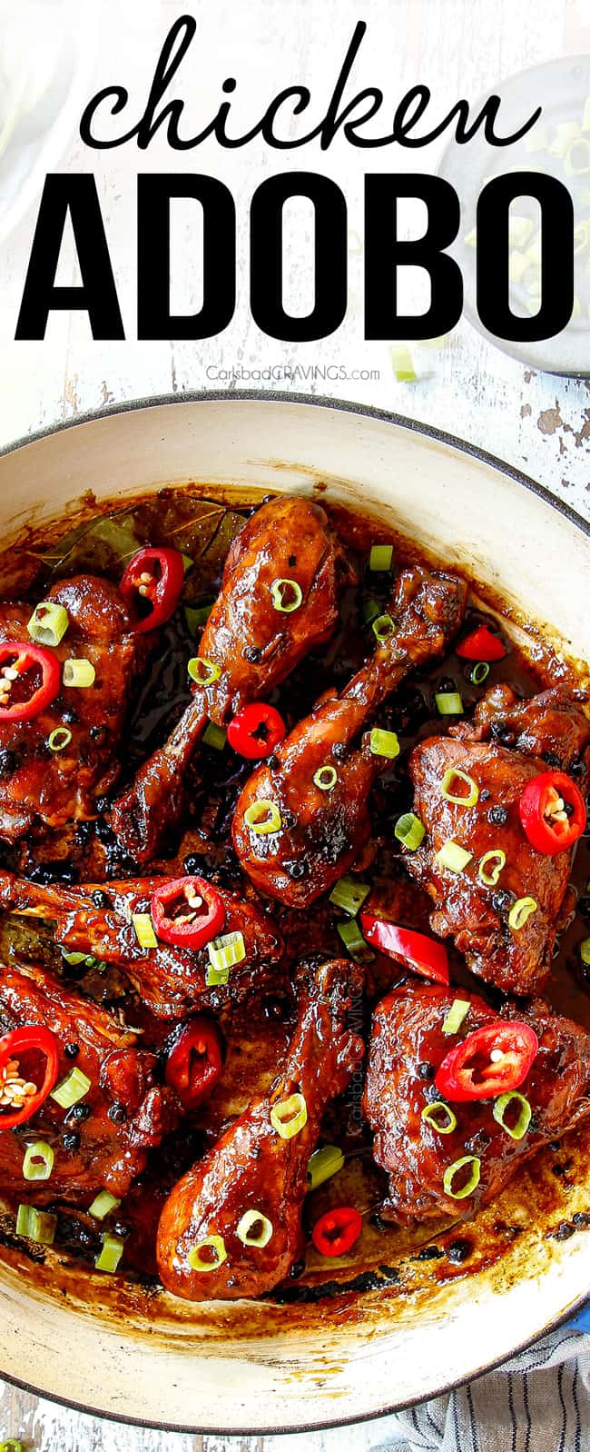 top view showing how to garnish Filipino Chicken Adobo in a skillet with green onions