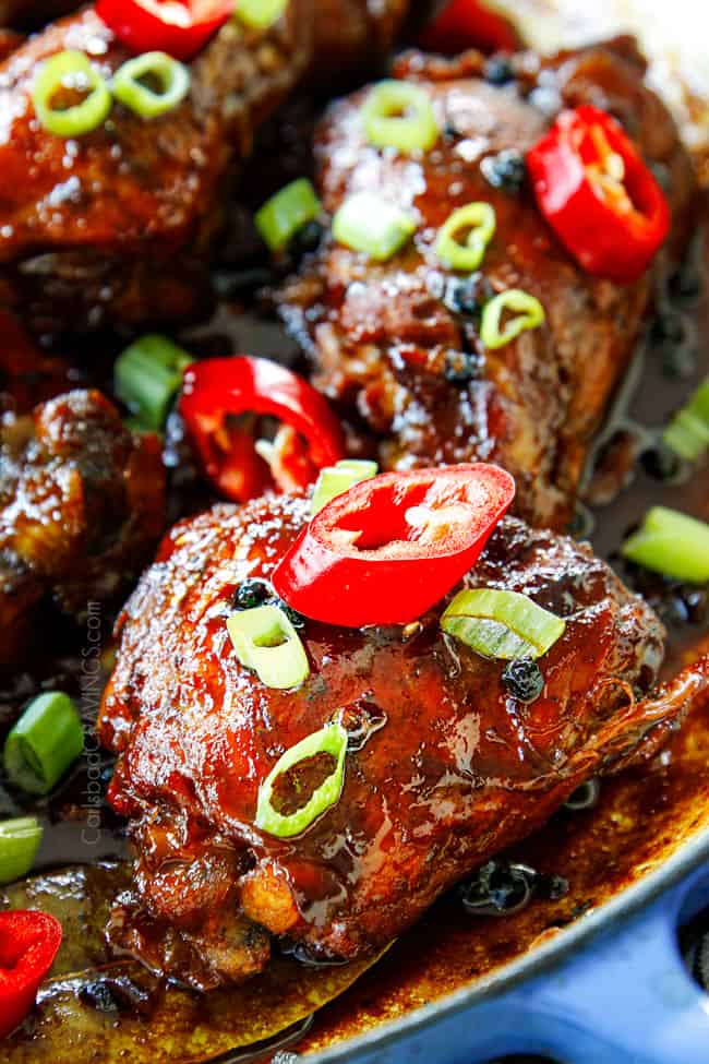 up close showing how to make Filipino Chicken Adobo by reducing sauce to a sticky glaze that coats the chicken