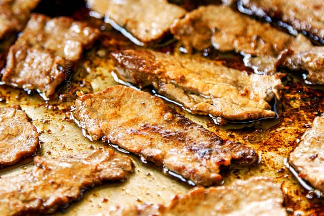 showing how to make Pepper Steak recipe by stir frying steak in a stainless steal skillet