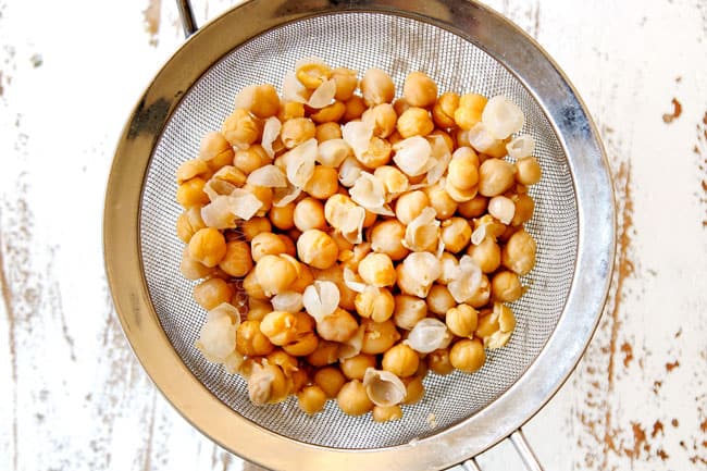 showing how to make hummus by simmering chickpeas until the skins are popping off