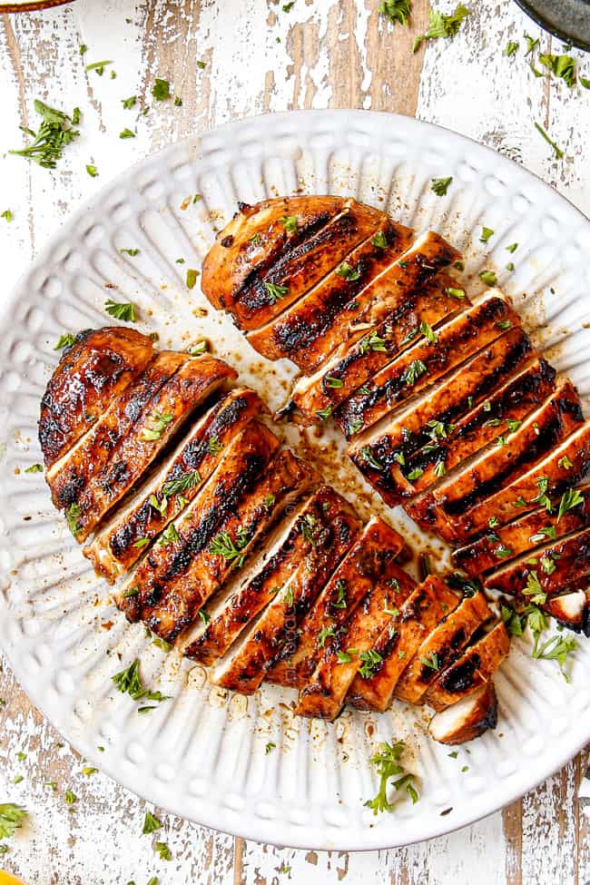 top view of marinated balsamic chicken on a white plate
