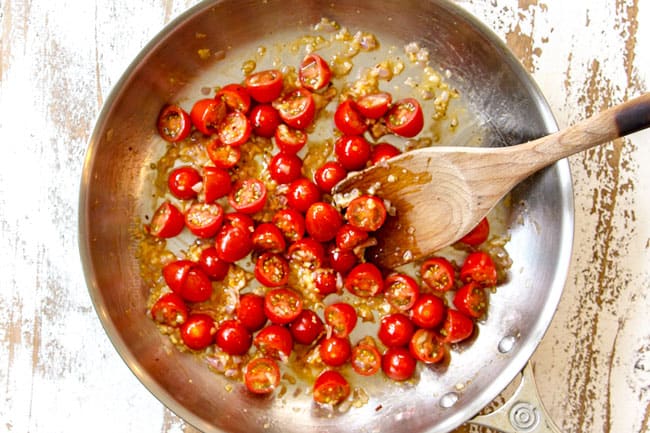 showing how to make Chicken Florentine by sauteing tomatoes, shallots and garlic together