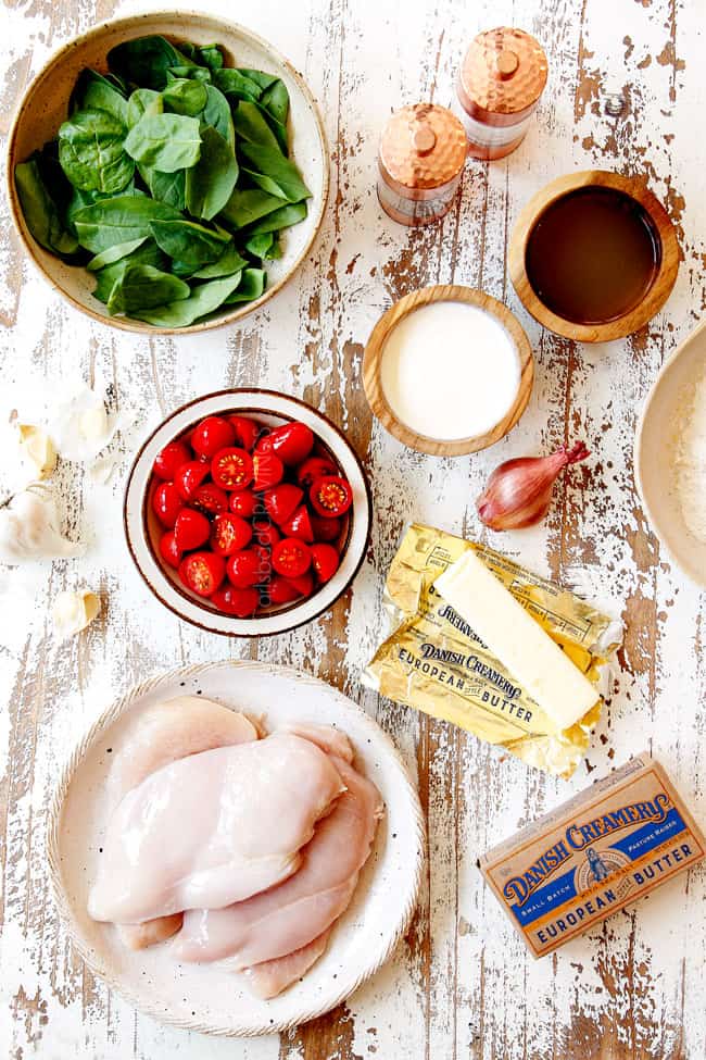 showing how to make Chicken Florentine recipe with a top view of the ingredients in bowls: spinach, tomatoes, chicken, heavy cream, butter
