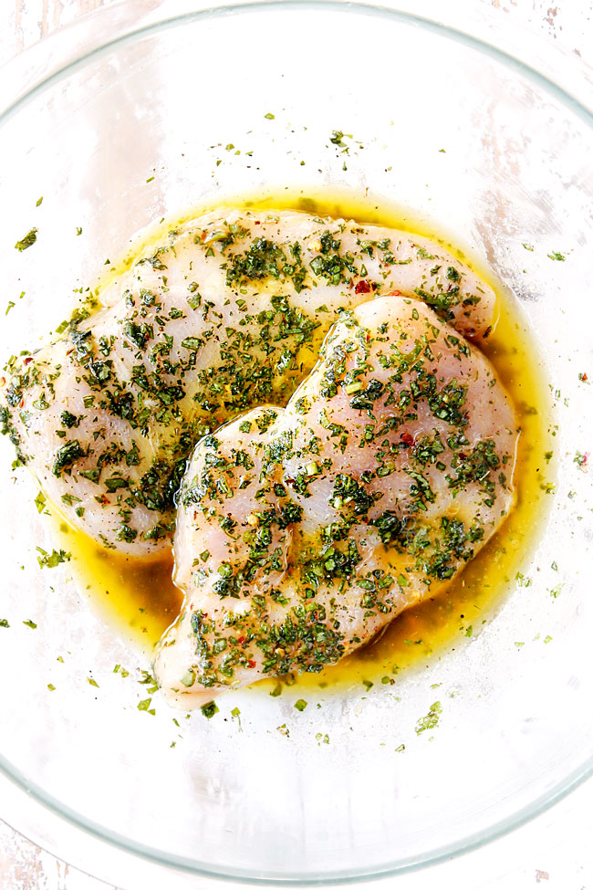 showing how to make chicken Caesar wraps by marinating chicken breasts to grill