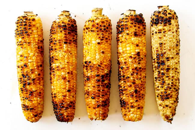 showing how to make esquites (Mexican Street Corn Salad) by grilling 5 pieces of corn on the cob
