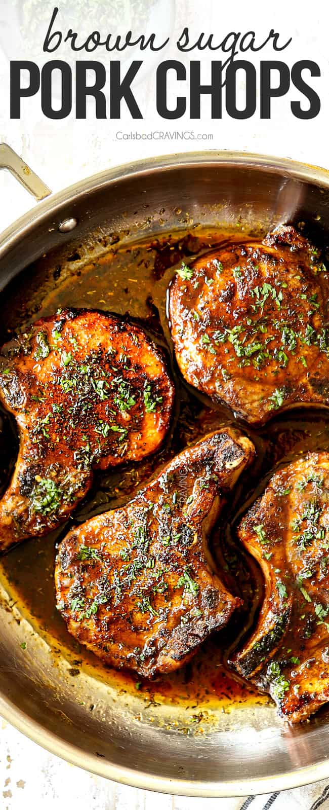 top view of baked brown sugar pork chops in a stainless steel skillet