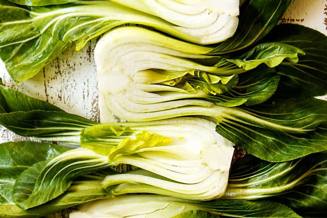 showing how to cut bok choy by slicing it in half lengthwise