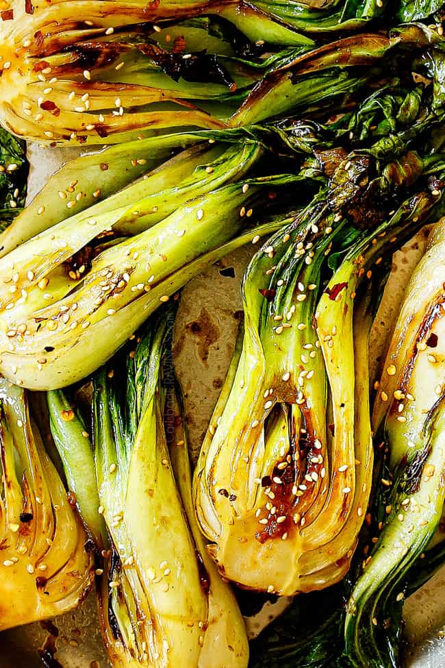 showing how to cook baby bok choy recipe by garnishing with sesame seeds