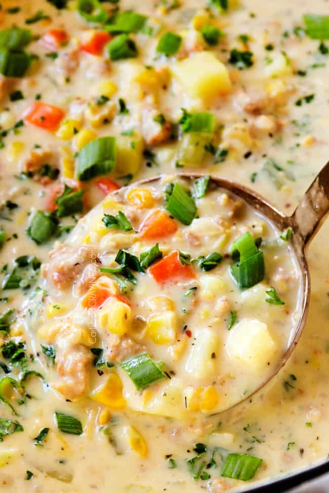 up close of corn chowder in a ladle