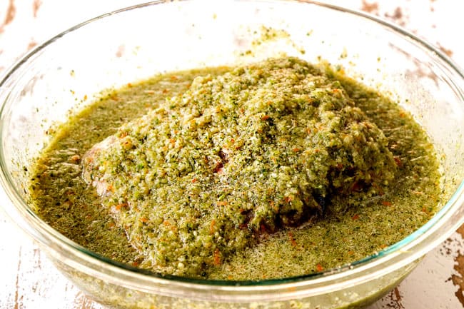 showing how to make Cuban roast pork for Cuban sandwich recipe (Cubanos) by marinating pork in mojo marinade