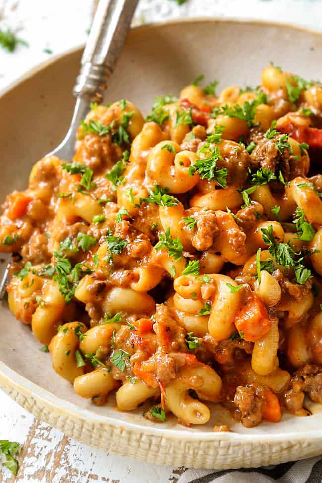 up close of a bowl of hamburger helper recipe showing how creamy and cheesy it is