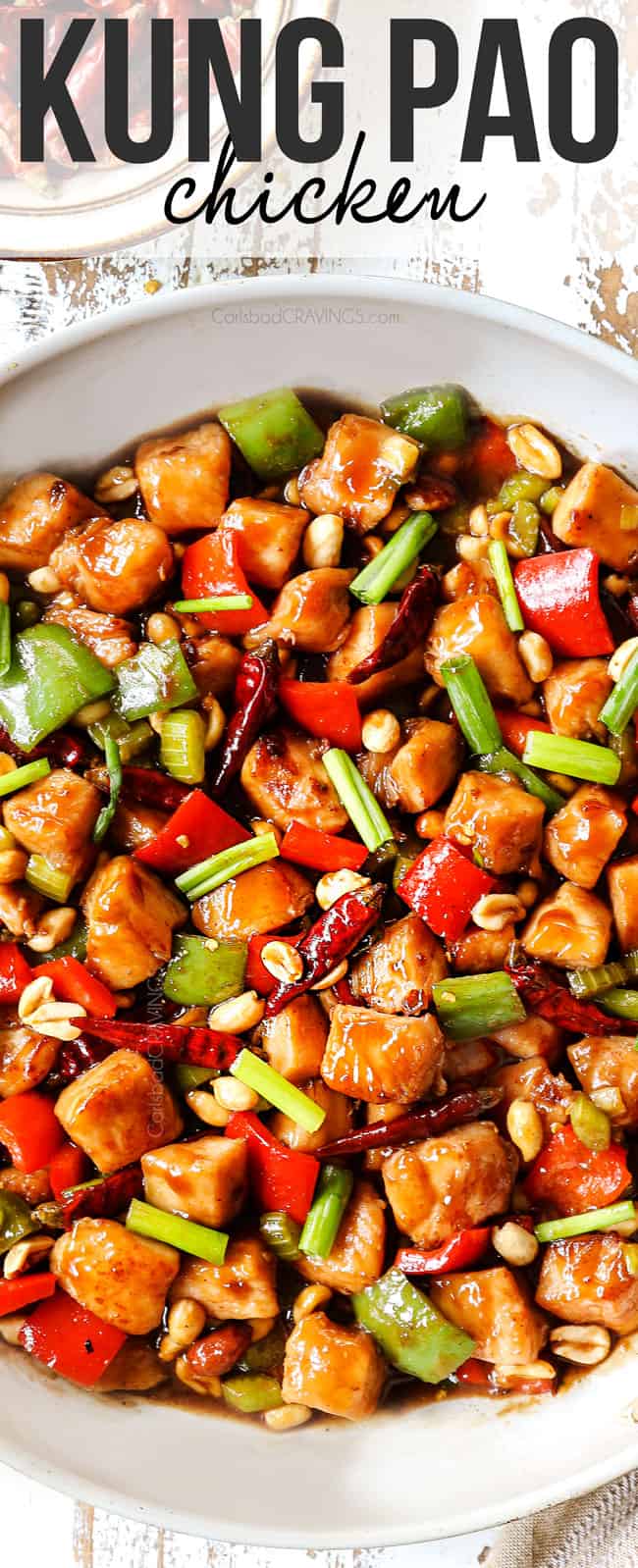 top view of kung pao chicken recipe in a white skillet