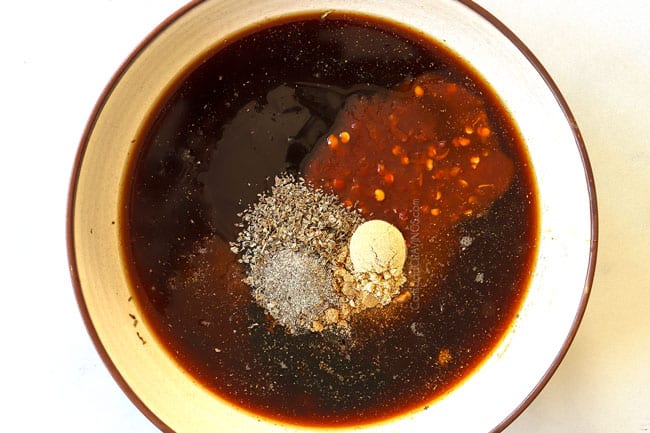 showing how to make pad see ew recipe by whisking together sauce ingredients of soy sauce, oyster sauce, brown sugar and chili sauce in a bowl