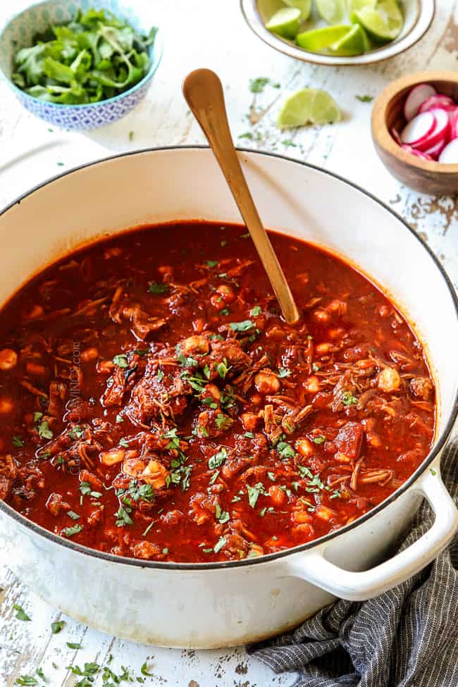 a pot of Mexican pozole soup recipe garnished with cilantro