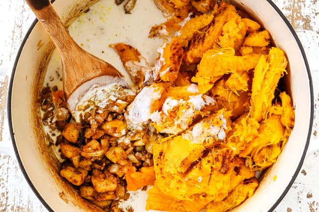 showing how to make creamy pumpkin soup recipe by adding pumpkin, coconut milk and broth to the soup