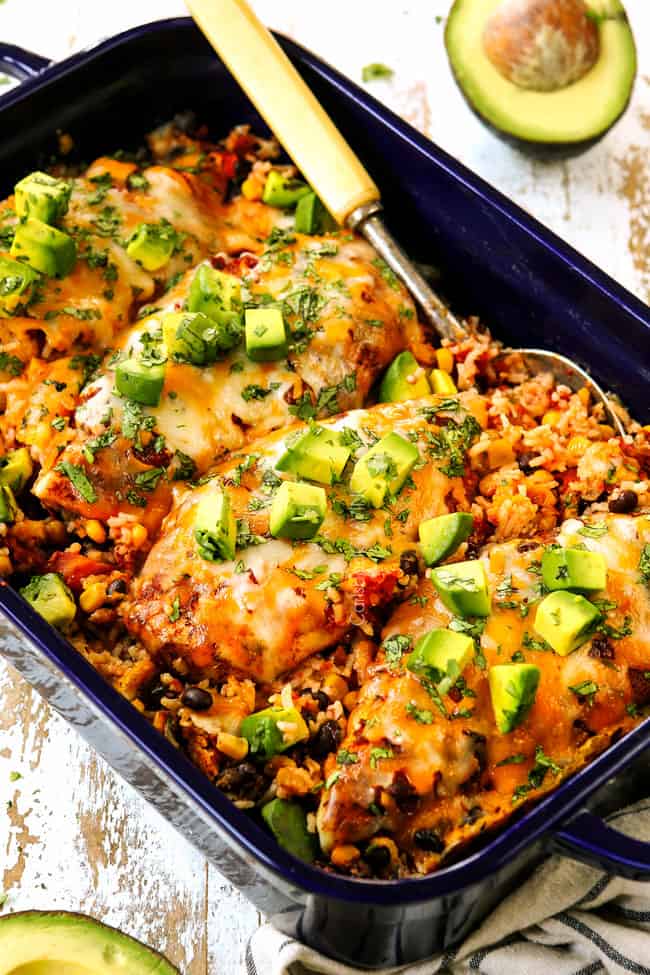 baked salsa chicken lined in a 9x13 baking dish with corn, beans and rice