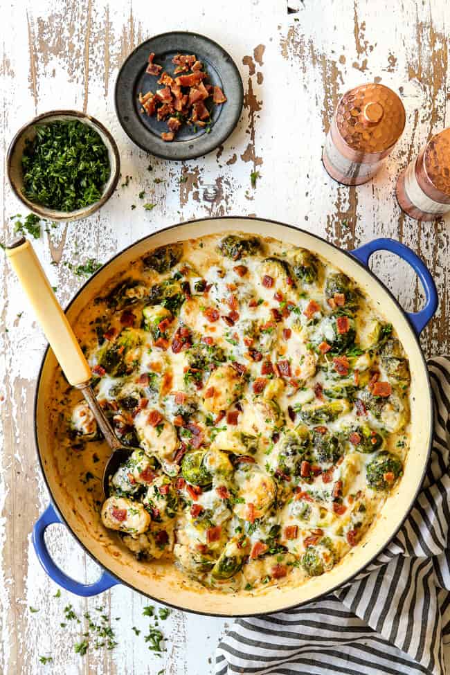 top view of Brussel sprouts recipe in large pan with a serving spoon