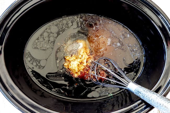 showing how to make crockpot beef and broccoli recipe by adding soy sauce, oyster sauce, sesame oil, garlic and ginger to the crockpot
