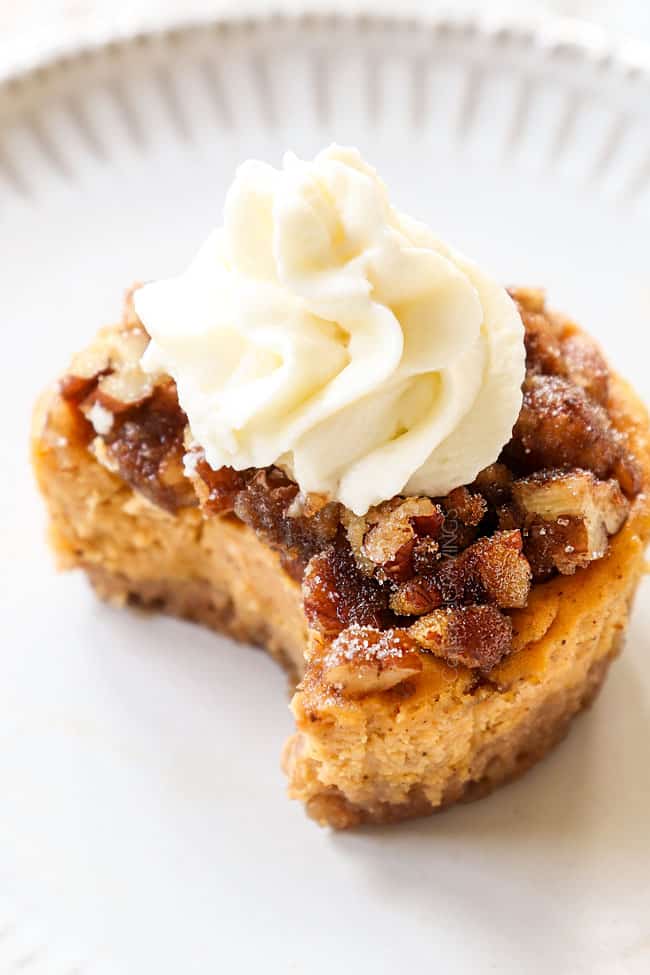 up close of mini pumpkin cheesecake with a bite out of it