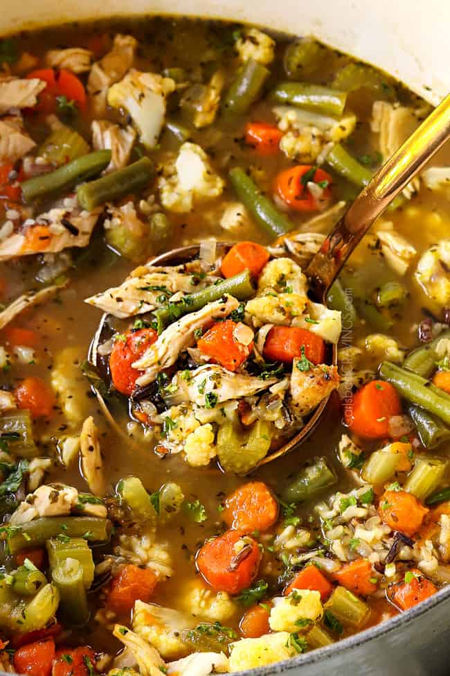 up close of a ladle of turkey rice soup recipe